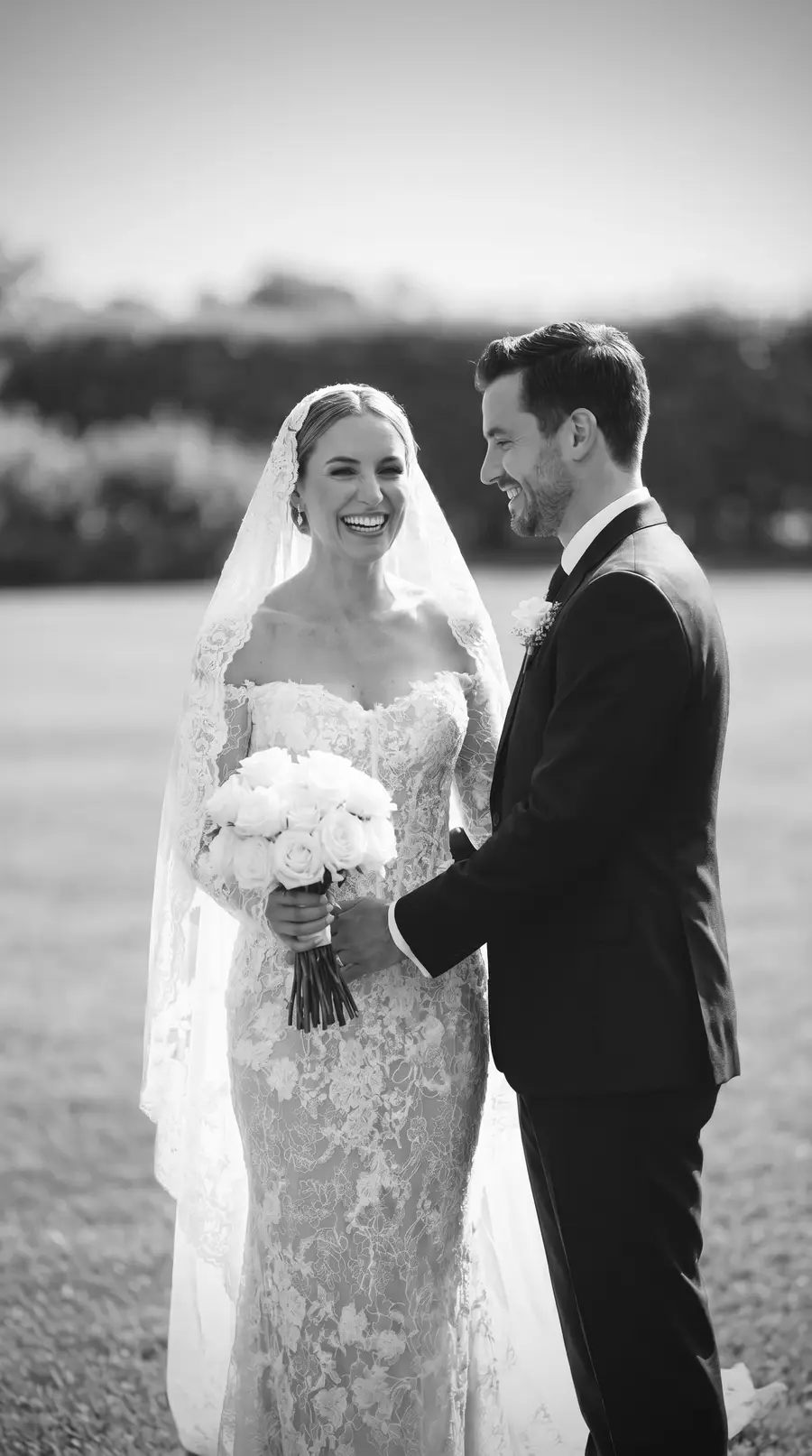 Bride in a custom lace mermaid wedding dress by VI Dressmakers