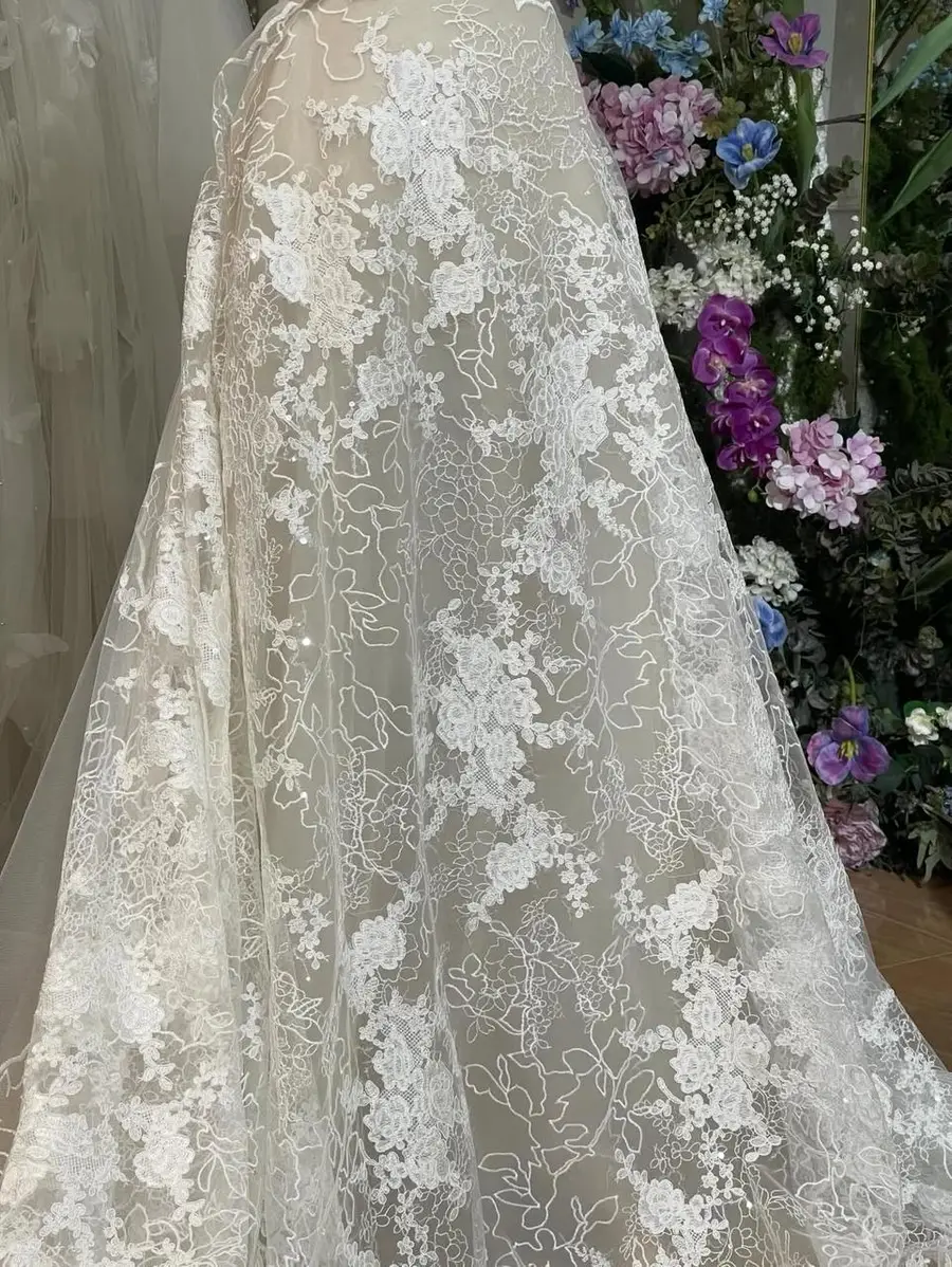VI Dressmakers atelier — floral lace and soft nude lining approved for Amelia's off-the-shoulder mermaid gown