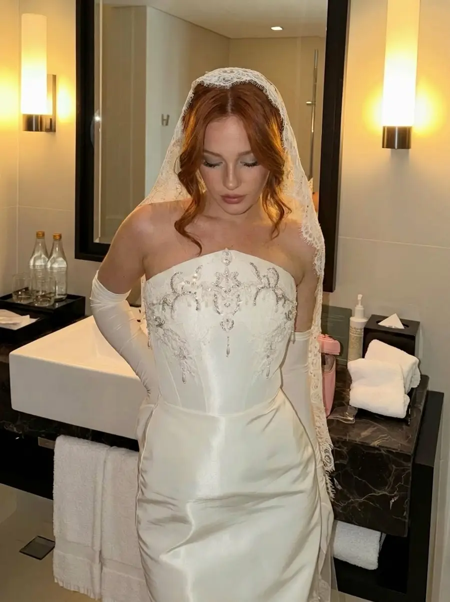 Getting-ready close-up — crystal chandelier embroidery with pearl drops on the bodice, lace mantilla, elbow gloves